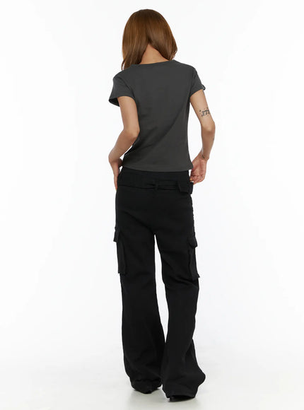 Studded Bootcut Pants CL503 Black full-length back view on model wearing grey crop tee, showing back cargo pockets and wide bootcut flare