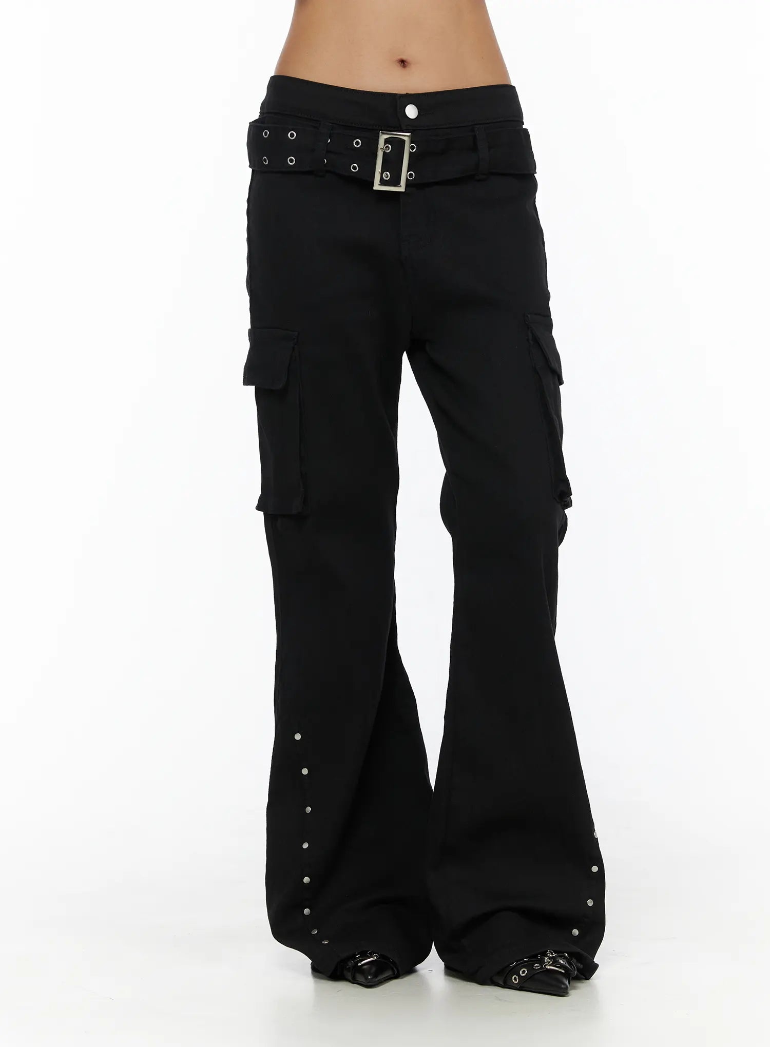 Studded Bootcut Pants CL503 Black front view on model cropped at waist, flared leg with cargo pockets and silver stud trim at hem