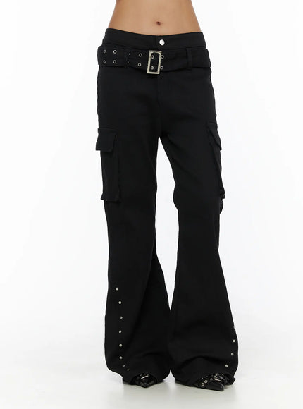 Studded Bootcut Pants CL503 Black front view on model cropped at waist, flared leg with cargo pockets and silver stud trim at hem