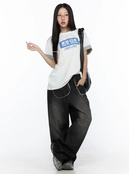 Studded Large Hobo Bag CL527 Black front view on model in white Tokyo Japan tee with wide-leg jeans, large slouchy hobo bag with studded strap on shoulder