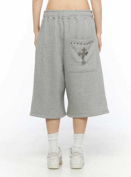Studded Sweatshorts CU530 Black flat-lay front showing wide-leg silhouette elastic ruched waistband drawstring tie side seam detail sweatshort fleece fabric