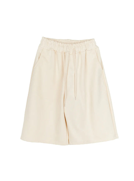 Studded Sweatshorts CU530 Ivory flat-lay front view wide-leg bermuda silhouette elastic ruched waistband drawstring tie side pockets clean minimal sweatshort