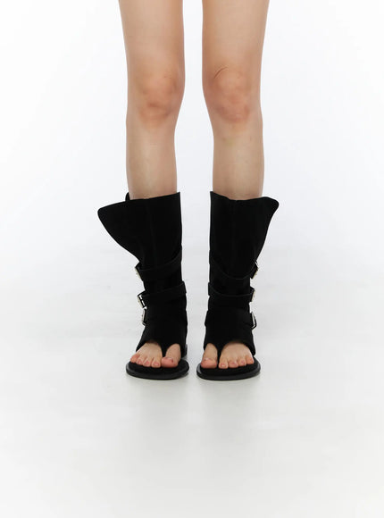 Suede Mid-Calf Boots CU530 Black front view on model both feet together showing open-toe thong design and triple buckle strap detailing on calf