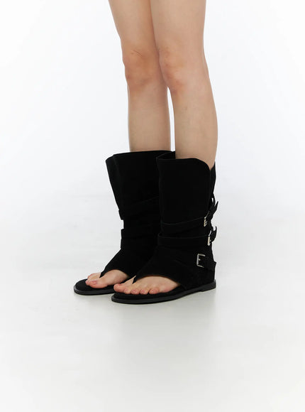 LEWKIN Suede Mid-Calf Boots CU530 Black side view on model standing straight showing triple silver buckle straps and open-toe thong sandal base