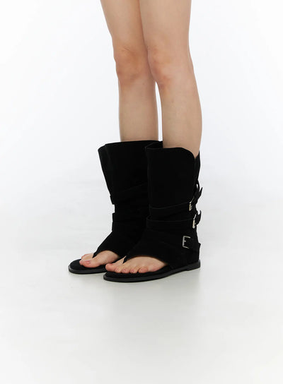 LEWKIN Suede Mid-Calf Boots CU530 Black side view on model standing straight showing triple silver buckle straps and open-toe thong sandal base