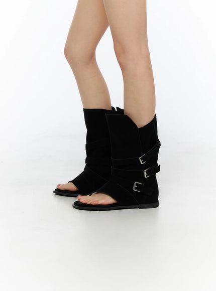 Suede Mid-Calf Boots CU530 Black angled side view on model highlighting three silver buckle straps on mid-calf suede shaft with toe-ring sandal sole