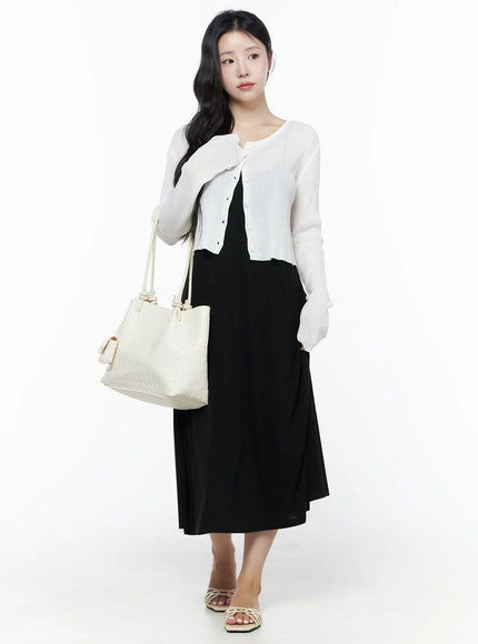 Summer Ribbed Crop Cardigan IU525 White full-body styled shot on model carrying cream tote bag paired with black midi skirt and strappy sandals