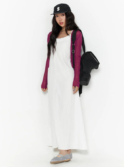 Summer Sheer Crop Cardigan CL510 Purple full-body front shot on model with black backpack and cap, white maxi dress and silver ballet flats, slight angle