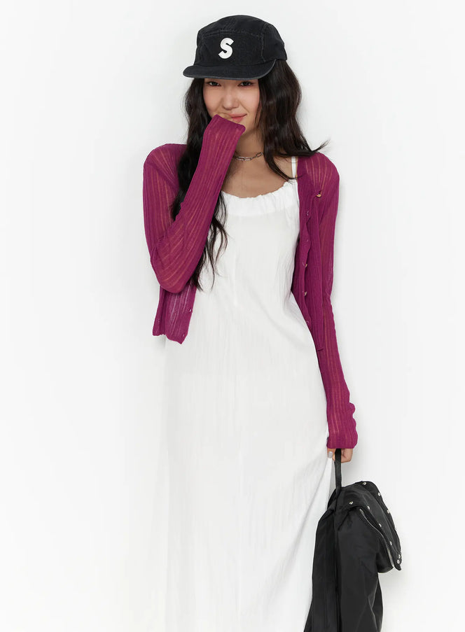 LEWKIN Summer Sheer Crop Cardigan CL510 Purple S/M front shot on model wearing black cap and white maxi dress, sheer ribbed knit with button front