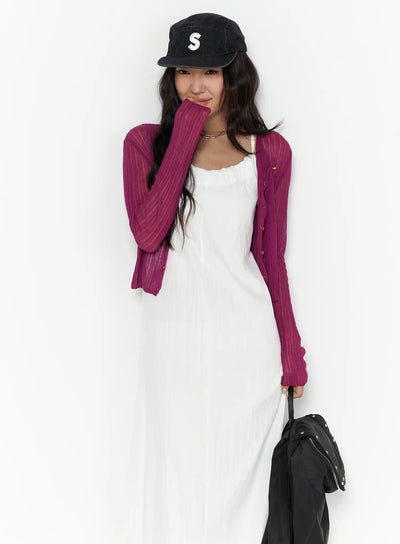 LEWKIN Summer Sheer Crop Cardigan CL510 Purple S/M front shot on model wearing black cap and white maxi dress, sheer ribbed knit with button front