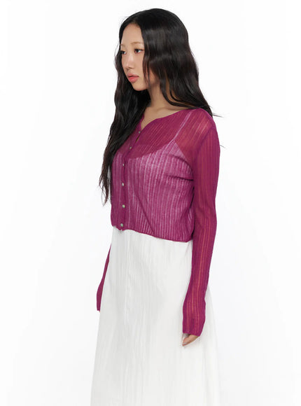 Summer Sheer Crop Cardigan CL510 Purple side shot on model showing sheer ribbed knit structure, long sleeves and cropped hem over white maxi dress