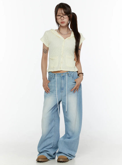 Summer Short Sleeve Hooded Knit Cardigan CL507 Yellow full-body front shot on model standing upright hands on hips, cropped silhouette styled with wide-leg blue jeans and chunky loafers
