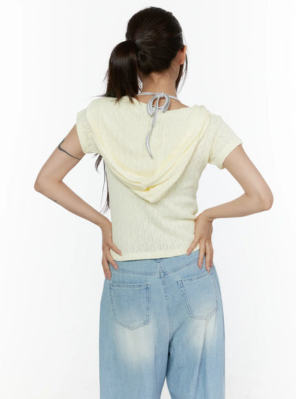 Summer Short Sleeve Hooded Knit Cardigan CL507 Yellow back shot on model hands on hips, showing hood with gray drawstring tie detail and pointelle openwork knit panel