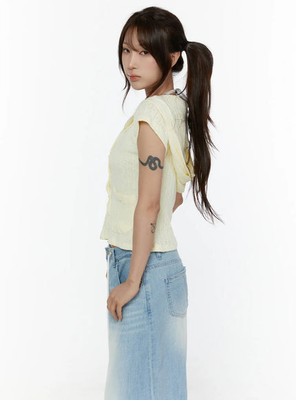 Summer Short Sleeve Hooded Knit Cardigan CL507 Yellow side shot on model showing cropped length and short sleeves, pointelle knit texture and hood tie visible from the side