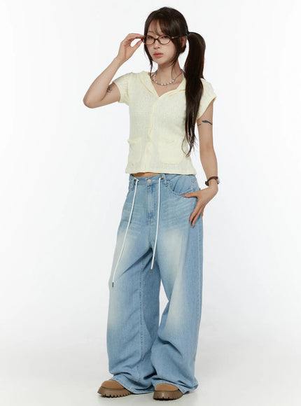 Summer Short Sleeve Hooded Knit Cardigan CL507 Yellow full-body three-quarter shot on model adjusting glasses, cropped fit with hood down styled over wide-leg light-wash jeans