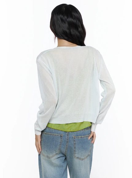 Summer V-Neck Cardigan CL510 Light gray back shot on model showing sheer semi-transparent knit fabric ribbed hem cuffs layered over yellow-green camisole