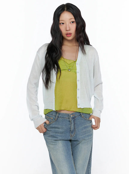 Summer V-Neck Cardigan CL510 Light gray front shot on model cropped view hands in jeans pockets sheer lightweight knit open over yellow-green camisole