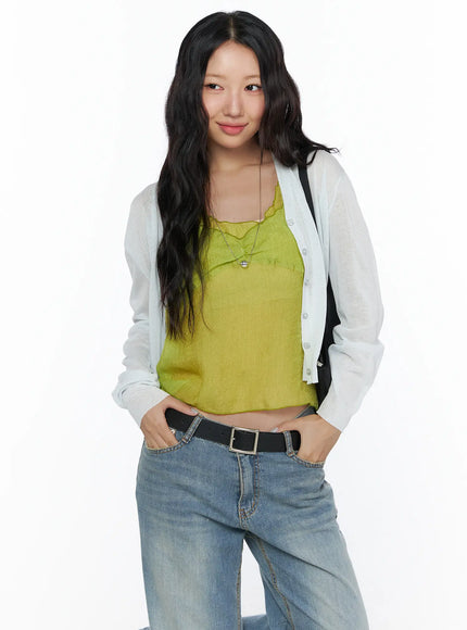 LEWKIN Summer V-Neck Cardigan CL510 Light gray front shot on model size S/M hands in pockets layered over yellow-green camisole with blue wide-leg jeans
