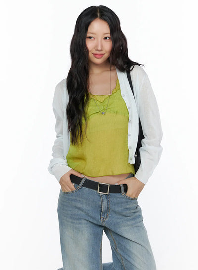 LEWKIN Summer V-Neck Cardigan CL510 Light gray front shot on model size S/M hands in pockets layered over yellow-green camisole with blue wide-leg jeans