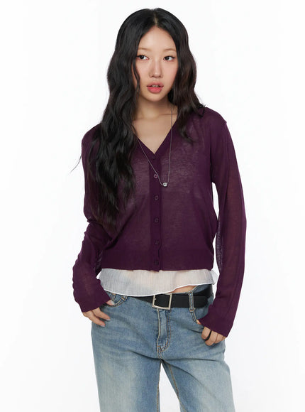 Summer V-Neck Cardigan CL510 Purple front shot on model cropped view V-neck button-front sheer knit layered over white ruffled top with belt and jeans