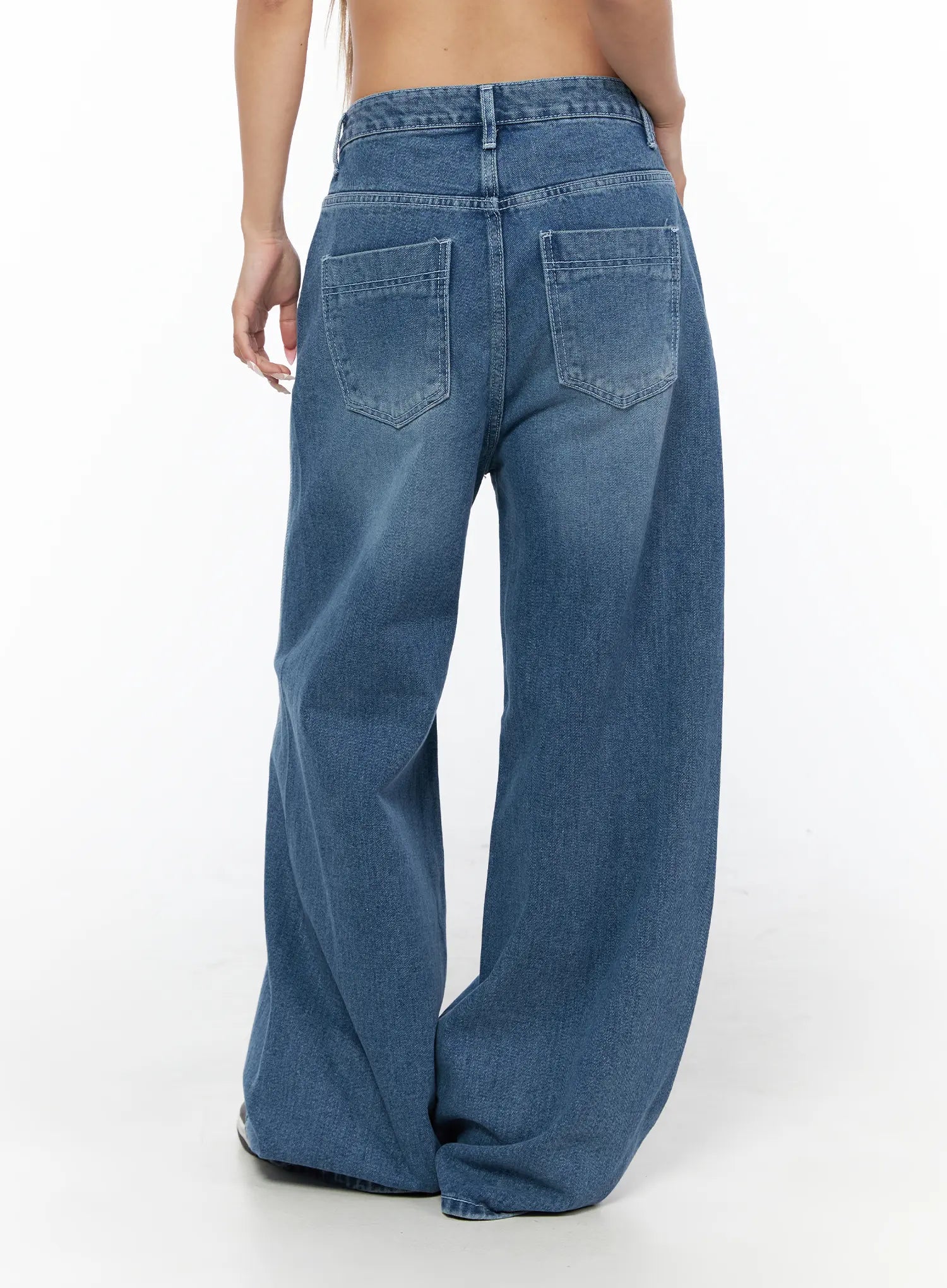 Suna Washed Wide Leg Jeans CU523 Blue back shot on model showing patch back pockets washed finish and oversized wide leg hem