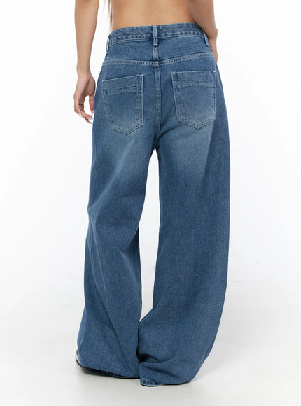 Suna Washed Wide Leg Jeans CU523 Blue back shot on model showing patch back pockets washed finish and oversized wide leg hem