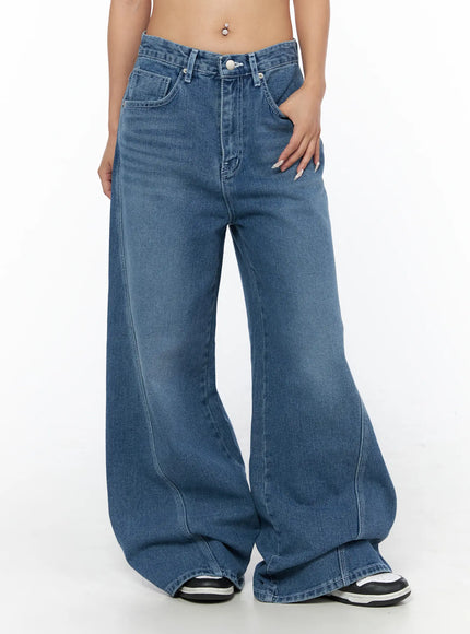 Suna Washed Wide Leg Jeans CU523 Blue front shot on model showing mid-rise fit front pockets and wide leg silhouette with sneakers