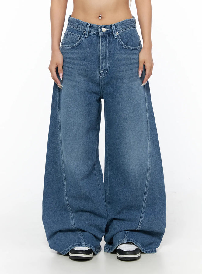 Suna Washed Wide Leg Jeans CU523 Blue front close-up on model showing mid-rise waistband button closure and ultra wide leg denim