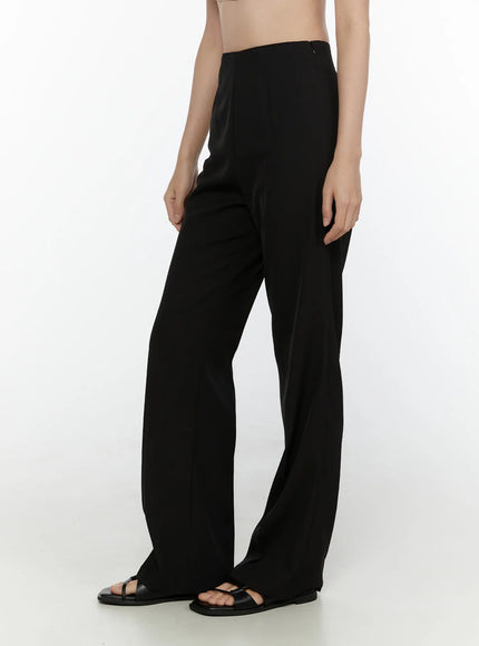 Tailored Flare Trousers CL521 Black side-view on model showing wide-leg flare silhouette with high waist and smooth fabric