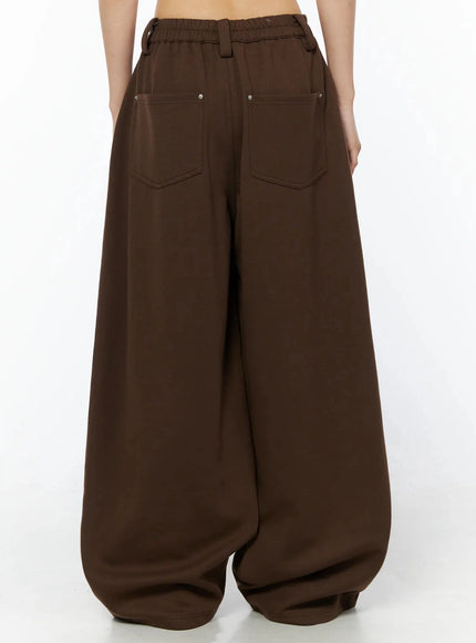 Tailored Wide Leg Sweatpants IL509 Brown back shot on model from waist down, showing elasticated waistband, two patch pockets with silver rivets