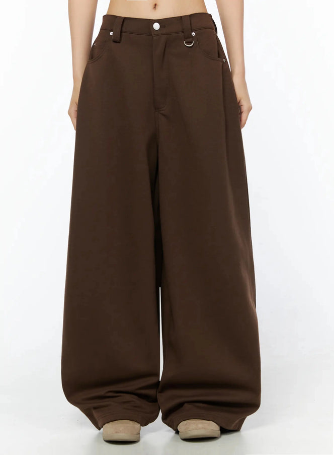 LEWKIN Tailored Wide Leg Sweatpants IL509 Brown front crop shot on model showing low-rise waistband with silver button, D-ring hardware, and slash pockets