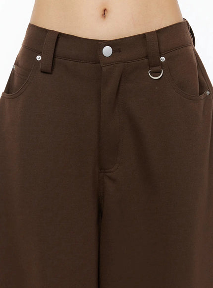 Tailored Wide Leg Sweatpants IL509 Brown close-up detail of front waistband showing silver snap button, D-ring accent, rivets, and slash pocket opening