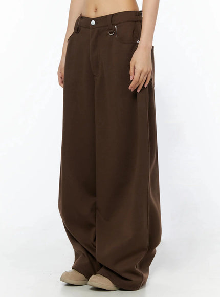Tailored Wide Leg Sweatpants IL509 Brown side shot on model from waist down, showing low-rise fit, D-ring hardware, and dramatically wide draping leg