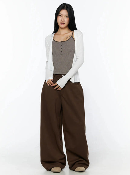 Tailored Wide Leg Sweatpants IL509 Brown full-length front shot on model styled with white cardigan and striped cami, holding pink tote bag with glasses