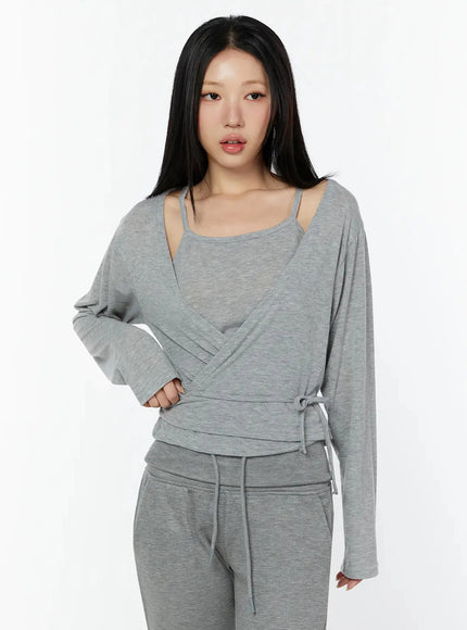 Tank And Layered Wrap Cardigan IU524 Gray front shot model wearing crossover wrap cardigan over built-in cami with side tie detail