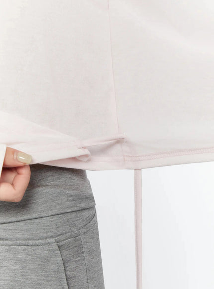Tank And Layered Wrap Cardigan IU524 Pink detail close-up shot showing side hem drawstring tie knot and soft lightweight fabric texture