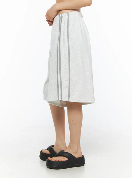 Tank Top and Track Shorts Set CL501 Light gray side close-up model shot of wide-leg shorts, dual gray vertical side stripes visible, elastic waistband, black platform sandals