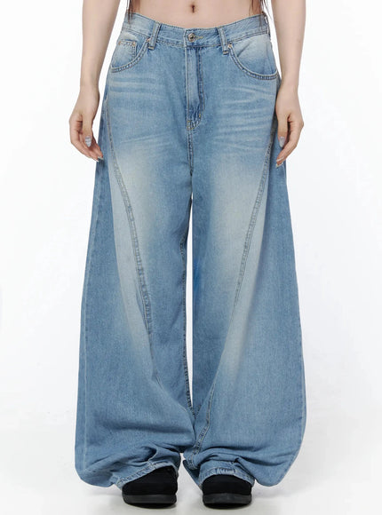 LEWKIN Teo Wide Leg Jeans IL506 Blue Size S front shot on model, cropped midriff view, ultra-wide leg silhouette with curved seam details and faded wash denim