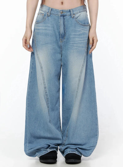 LEWKIN Teo Wide Leg Jeans IL506 Blue Size S front shot on model, cropped midriff view, ultra-wide leg silhouette with curved seam details and faded wash denim