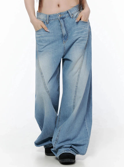 Teo Wide Leg Jeans IL506 Blue front close-up on model hands in pockets, showing curved seam panel construction and faded wash on wide leg