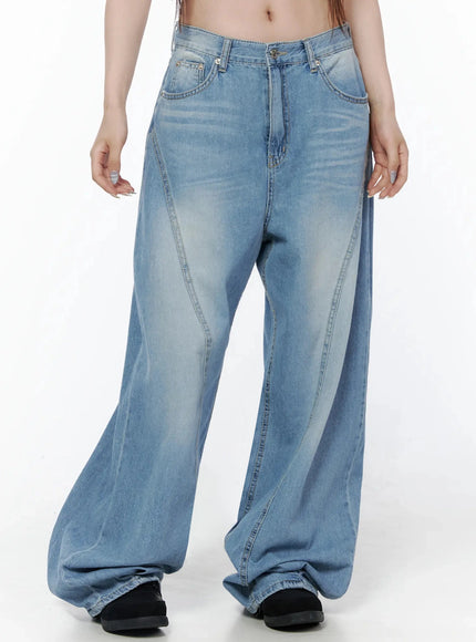 Teo Wide Leg Jeans IL506 Blue front shot on model, waist-to-hem view showing curved seam panel design, faded blue denim, and extra-wide leg