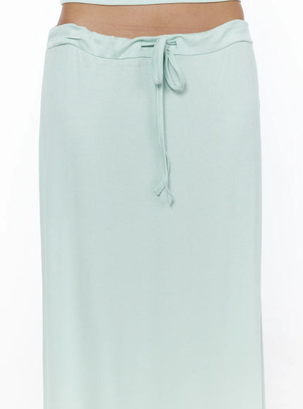 Tie-Waist Maxi Skirt CL503 Mint close-up detail shot on model highlighting center drawstring bow, ribbed waistband texture and soft knit fabric