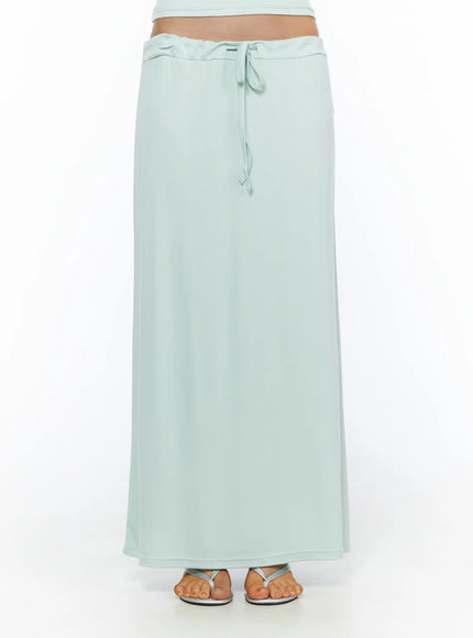 Tie-Waist Maxi Skirt CL503 Mint front shot on model showing full-length ribbed maxi skirt with low-rise tie waist and silver flip-flop sandals