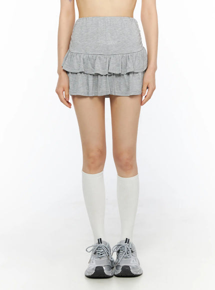 Tiered Flare Mini Skirt CU530 Gray front shot on model showing folded high waistband and double-layer flared ruffle skirt with heathered knit texture