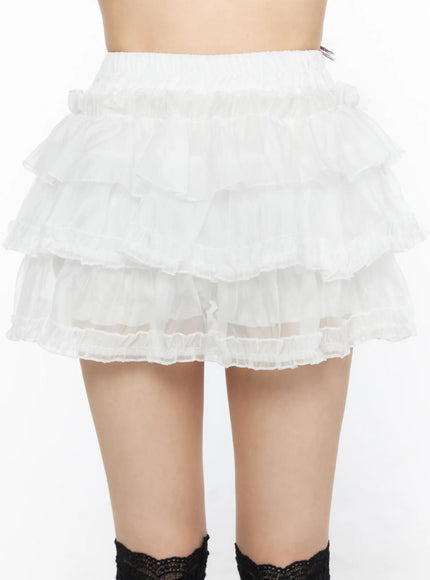 Tiered Mesh Mini Skirt CL522 White close-up front detail shot on model showing four-tier organza ruffle layers elastic waistband and sheer mesh texture without accessories