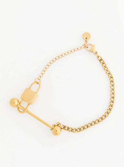 LEWKIN Titan Bar Bracelet IL522 Gold flat-lay on white background showing full bracelet with padlock charm, ball ends, curb chain, and lobster clasp extender