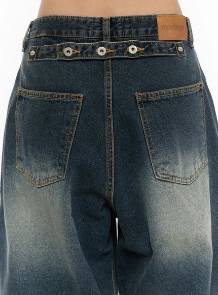 Tuli Back-Belt Detail Baggy Jeans CU529 Dark blue close-up back detail shot showing snap-button belt strap dual back pockets ozbridge leather patch and faded wash