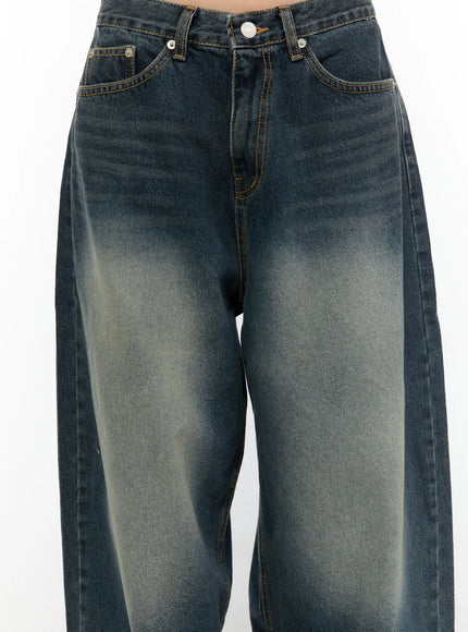 Tuli Back-Belt Detail Baggy Jeans CU529 Dark blue close-up front detail shot showing waistband coin pocket button fly and heavy vintage faded wash texture