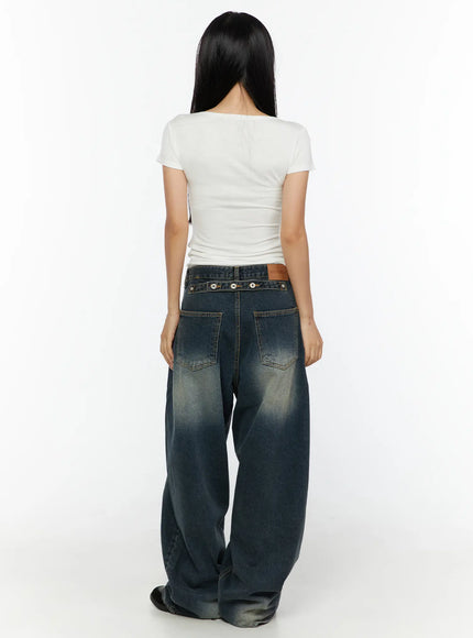Tuli Back-Belt Detail Baggy Jeans CU529 Dark blue full back shot on model styled with white tee showing snap-button waist strap dual back pockets and pooling hem