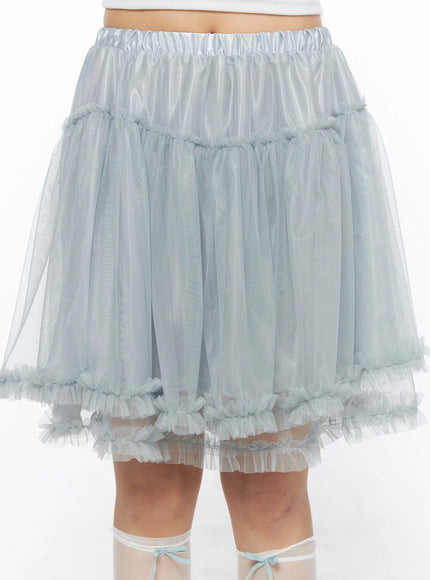 Tulle Frill Hem Midi Skirt CL514 Light blue close-up front detail shot on model, elastic satin waistband with tiered gathered tulle and double frilled hem